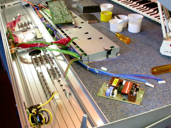 A Korg Triton with the Button circuit boards removed